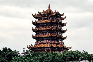 Yellow Crane Tower rising above trees in Wuhan.